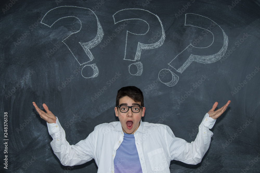 young teenager on the blackboard with question mark young teenager on the blackboard with question mark