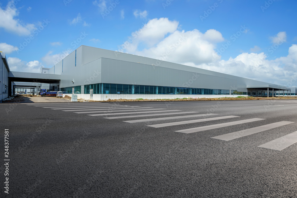Road asphalt pavement and modern factory warehouse.. Road asphalt pavement and modern factory warehouse..