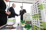 Business handshake of architect and investor