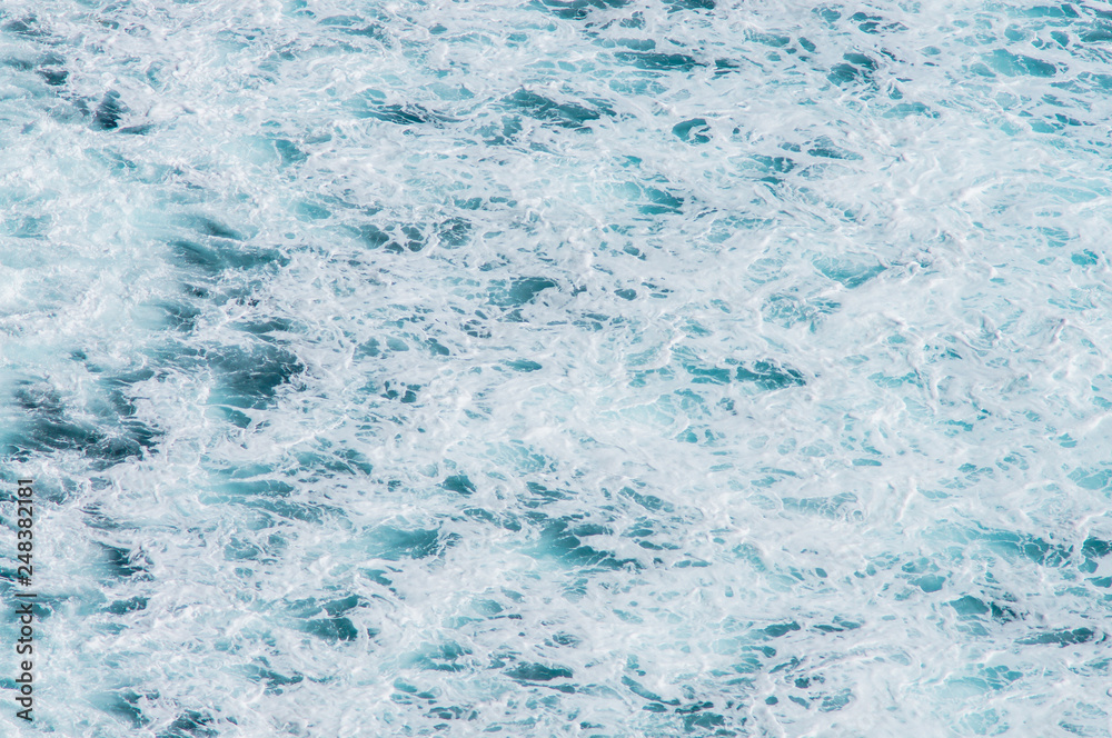 Fototapeta premium Texture of the Ocean. Natural background of blue-green sea water with foam