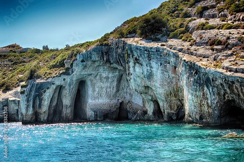 Blue caves on the sea in Zakynthos in Greece. Clear water of medditerian sea in sunny day at summer.