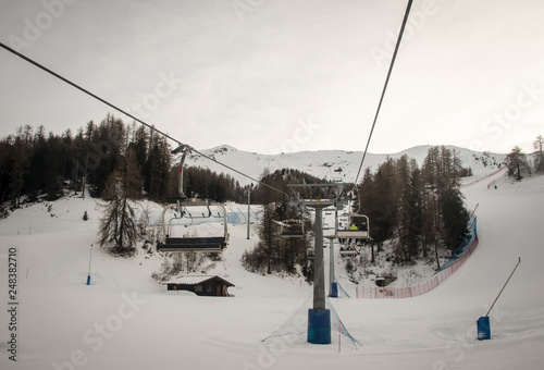 Ski chairlift at the ski slopes Aosta Valley, Italy .