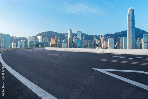Road and skyline of modern urban architecture in Hong Kong..