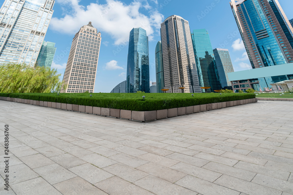 Empty square floor tiles and skyline of modern urban buildings in Shanghai.. Empty square floor tiles and skyline of modern urban buildings in Shanghai..