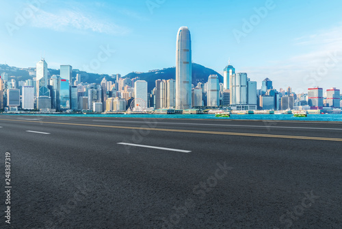 Road and skyline of modern urban architecture in Hong Kong..