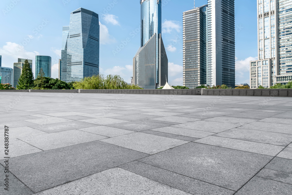 Empty square floor tiles and skyline of modern urban buildings in Shanghai.. Empty square floor tiles and skyline of modern urban buildings in Shanghai..