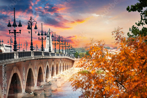 The Pont de pierre in Bordeaux across the Garonne River, France