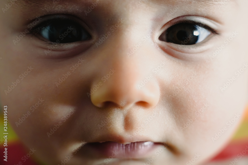 Close-up of the look of a funny baby. Close-up of the look of a funny baby.