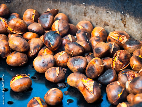 Grilled chestnuts for sale in a market stall.Cooking, Chestnut - Food, Fire - Natural Phenomenon, Roasted, Autumn