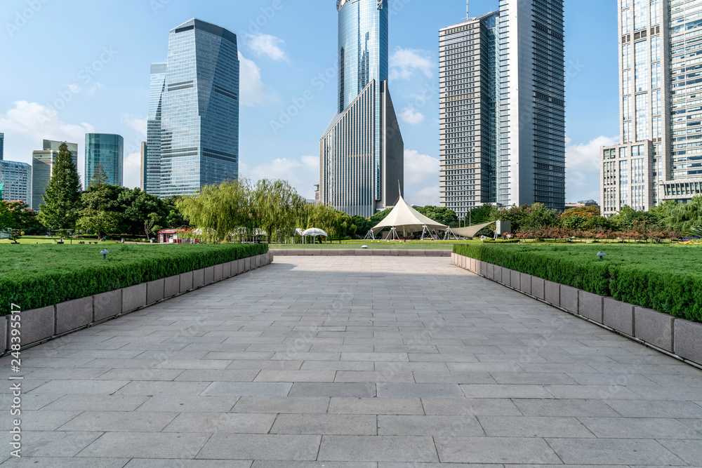 Empty square floor tiles and skyline of modern urban buildings in Shanghai.. Empty square floor tiles and skyline of modern urban buildings in Shanghai..