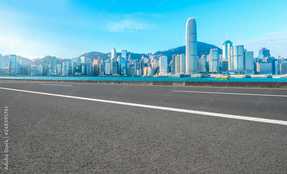 Road and skyline of modern urban architecture in Hong Kong..