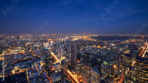 night cityscape in metropolis with lighting up building