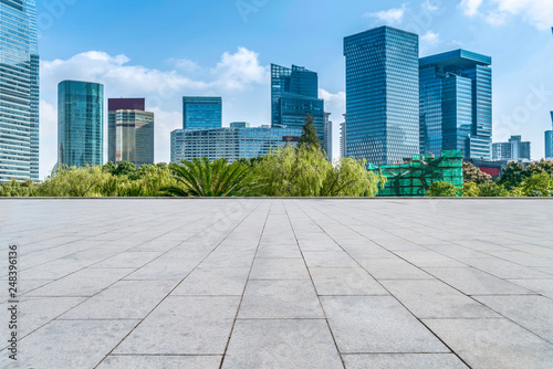 Empty square floor tiles and skyline of modern urban buildings in Shanghai.. © 昊 周