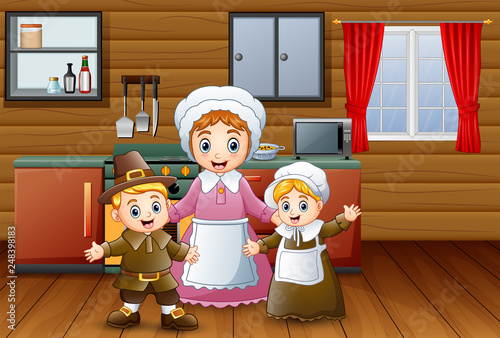 Happy children and mother in the kitchen