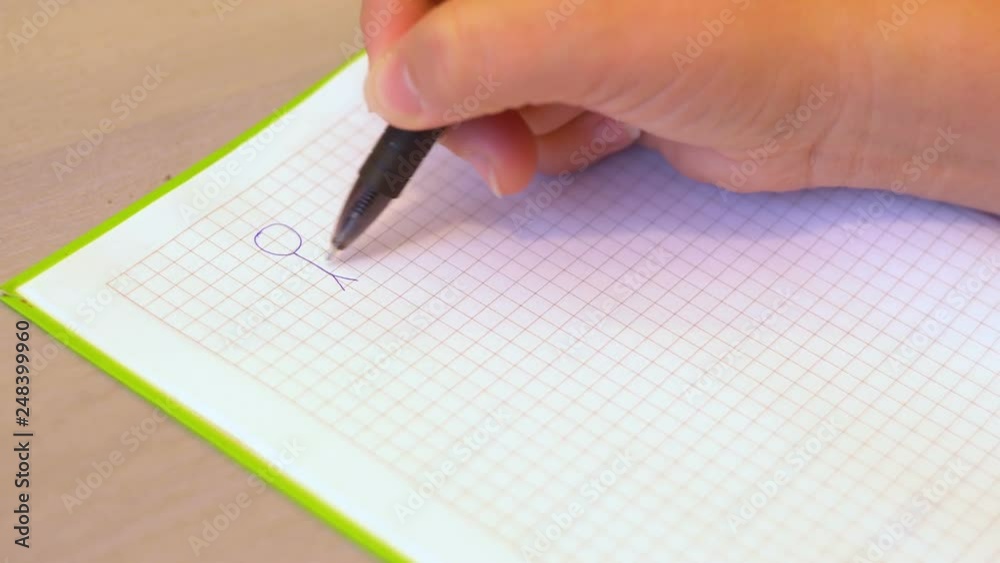 Ballpoint pen draw in a notebook. Love text. Graphic image. Female hand. Close up. 4K video