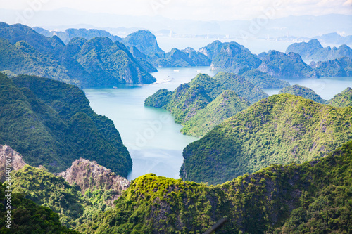 scenic view over Ha Long bay from Cat Ba island, Ha Long city in the background, UNESCO world heritage site, Vietnam