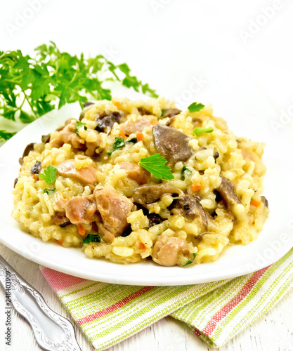 Risotto with mushrooms and chicken on towel