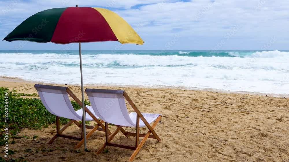 White beach chairs and umbrellas on Karon Beach, Phuket, Thailand White beach chairs and umbrellas on Karon Beach, Phuket, Thailand