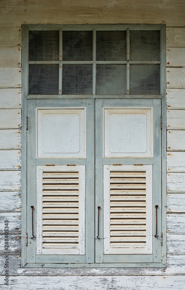 Detailed shoot of window in old house in Thailand. Thai wood house.