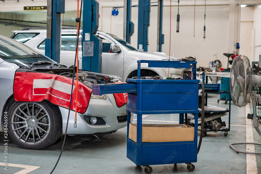 Car repair service center with fixing tool trolley