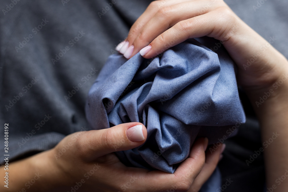 fabric in women's hands fabric in women's hands