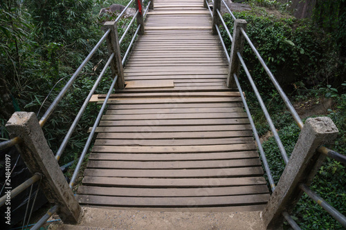 Fototapeta Naklejka Na Ścianę i Meble -  Top view wooden stair over forest hill