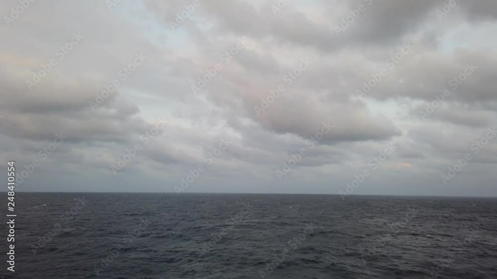 Stormy clouds over dark ocean Stormy clouds over dark ocean