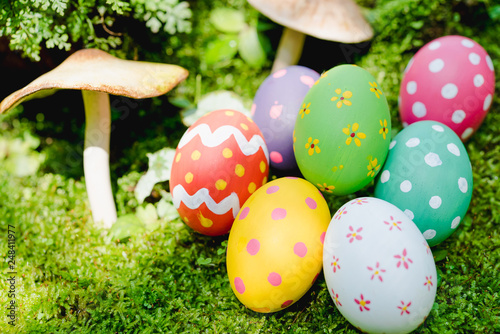 Beautiful Easter multi color egg on garden green grass