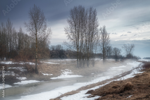 fog over the melting lake in early spring © smolskyevgeny