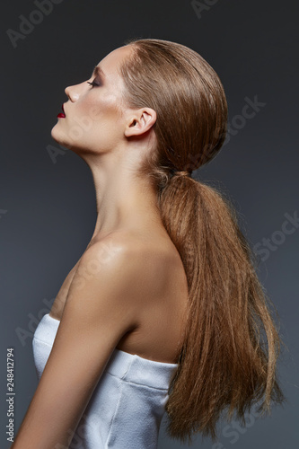 beautiful girl with long ponytail and red lips