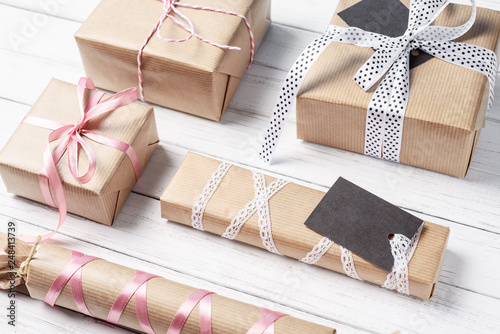 A lot of gift boxes with ribbon on a white background, copy space