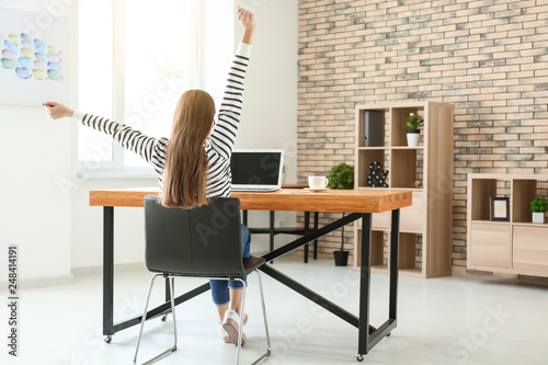 Happy female freelancer wor...