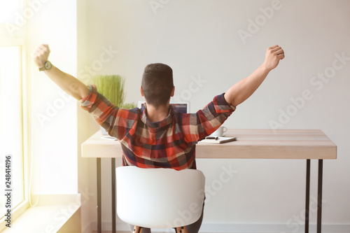 Happy young freelancer work...