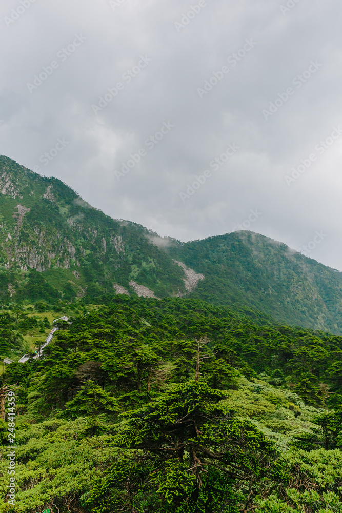 Mountain ridges under clouds and fog on top of Cangshan Mountains in Dali, Yunnan, China Mountain ridges under clouds and fog on top of Cangshan Mountains in Dali, Yunnan, China