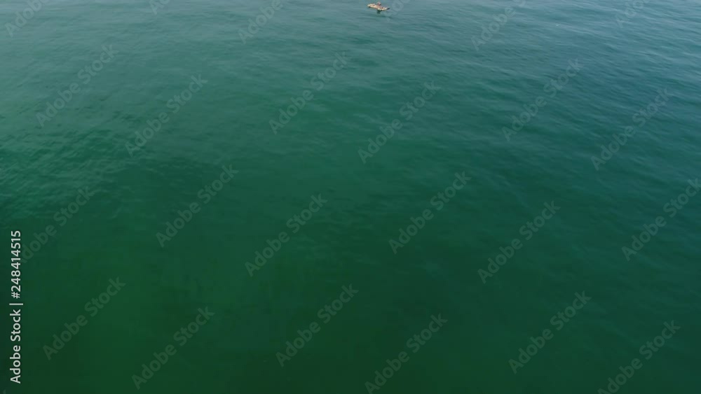 Traditional fisher on a raft in Peru. Pacific Ocean near Mancora Traditional fisher on a raft in Peru. Pacific Ocean near Mancora