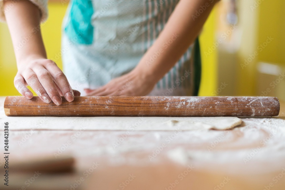 girl in kitchen working with daugh. girl in kitchen working with daugh.