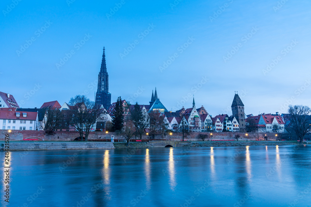 Germany, Minster and houses of city ulm reflecting in river water