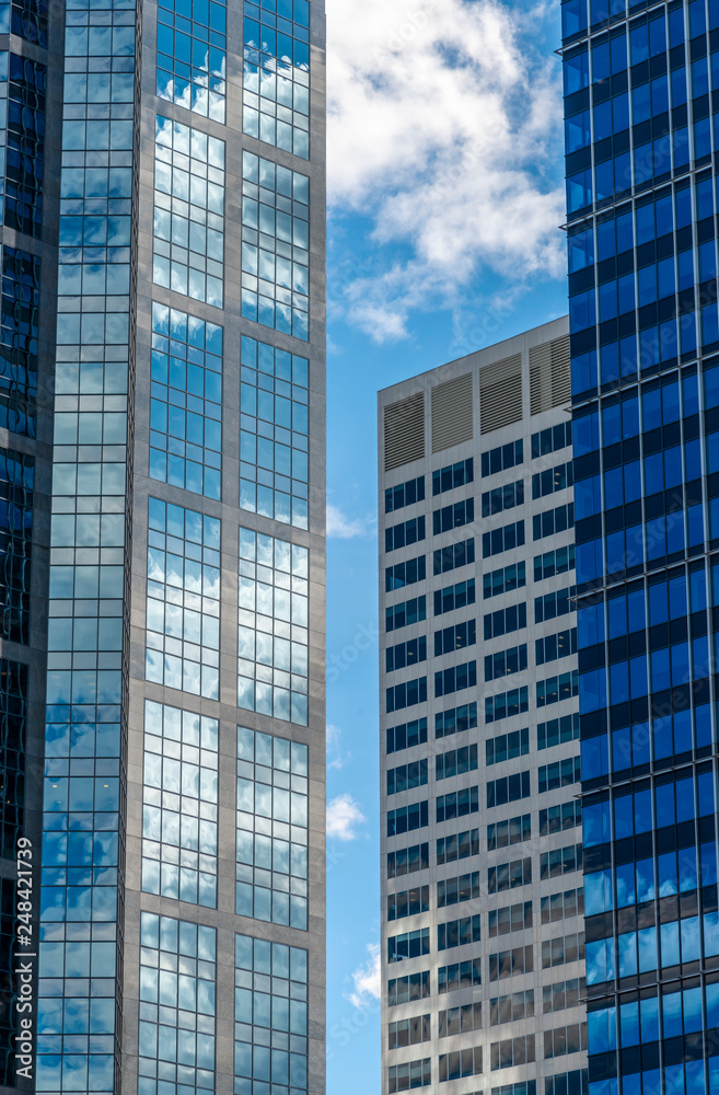 Building facade with sky reflection on windows