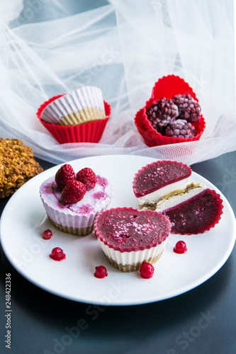 Valentines day desserts.Raw vegan mini cakes made with strawberries, cocoa butter, cashew and dates