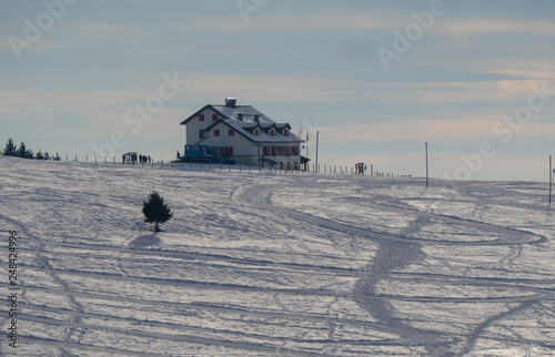 Landscape to the Magnolini lodge at Monte Pora ski area in winter season. Orobie Alps. Italy