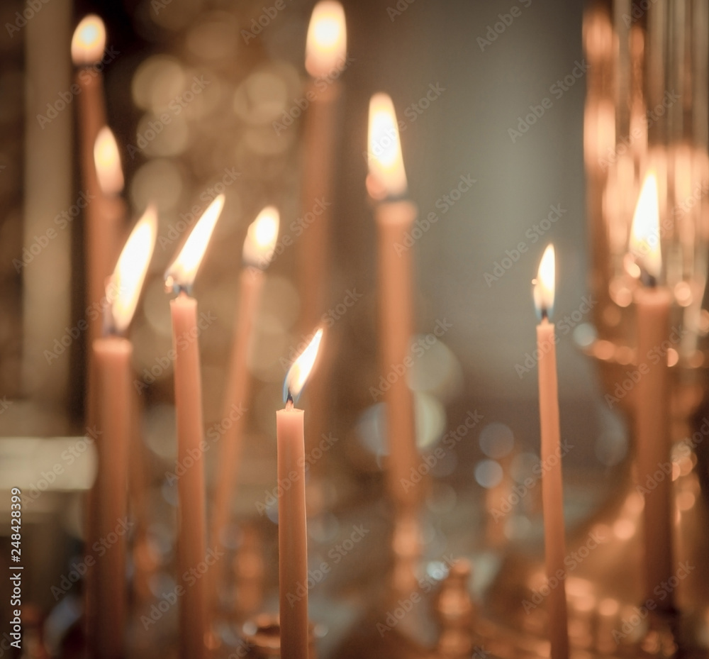 Church. Wax candles. Lighted candles in the church Church. Wax candles. Lighted candles in the church