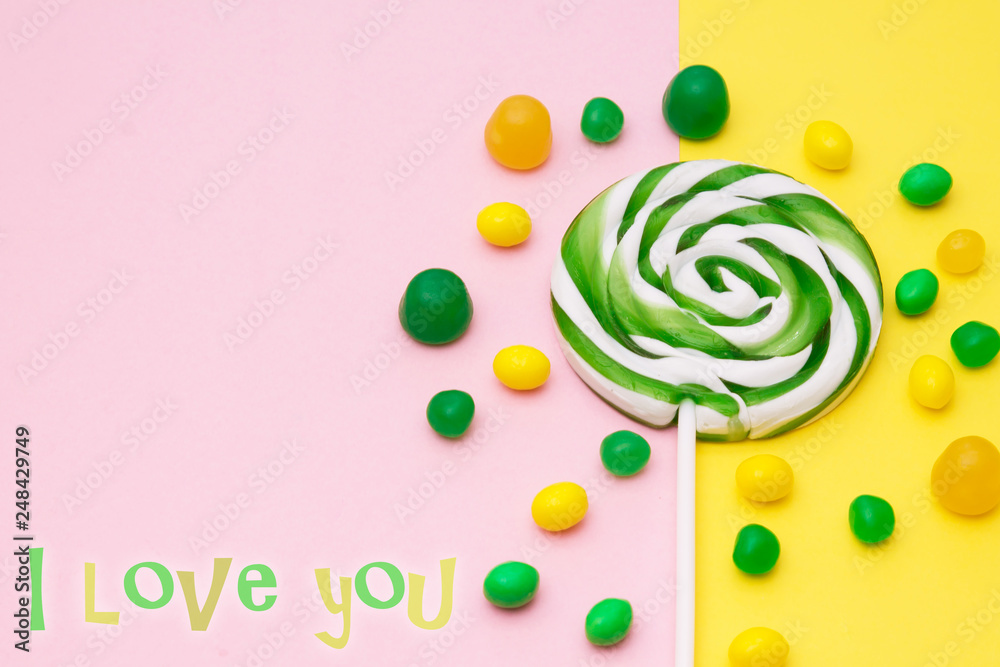 valentines card with lollipops on colorful background