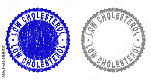 Grunge LOW CHOLESTEROL stamps isolated on a white background. Rosette seals with grunge texture in blue and grey colors. Vector rubber stamp imitation of LOW CHOLESTEROL title inside round rosette.