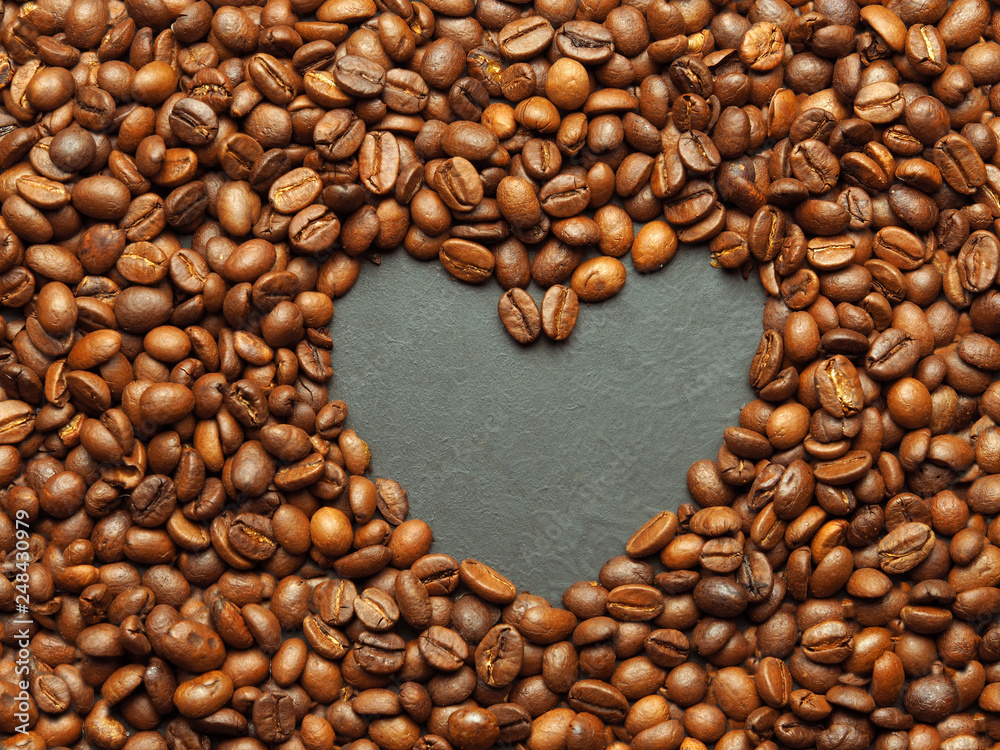 Coffee beans as a background and texture in the form of a heart Coffee beans as a background and texture in the form of a heart