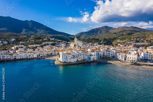 Fototapeta Naklejka Na Ścianę i Meble -  amazing aerial panoramic view photo of Cadaques small cizy city by the sea in Spain. Sunny day and big clouds. Mountains. Nature