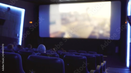 cinema hall with viewers and unidentified film on the screen photo