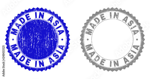 Grunge MADE IN ASIA stamp seals isolated on a white background. Rosette seals with grunge texture in blue and gray colors. Vector rubber stamp imprint of MADE IN ASIA caption inside round rosette.