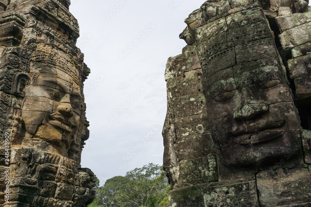 Massive stone faces at the Bayon Temple in Siem Reap