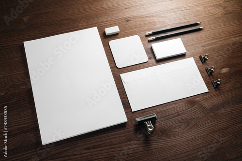 Blank corporate stationery for branding design. Corporate identity set on wooden background.