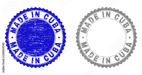 Grunge MADE IN CUBA stamp seals isolated on a white background. Rosette seals with distress texture in blue and gray colors. Vector rubber stamp imitation of MADE IN CUBA text inside round rosette. photo